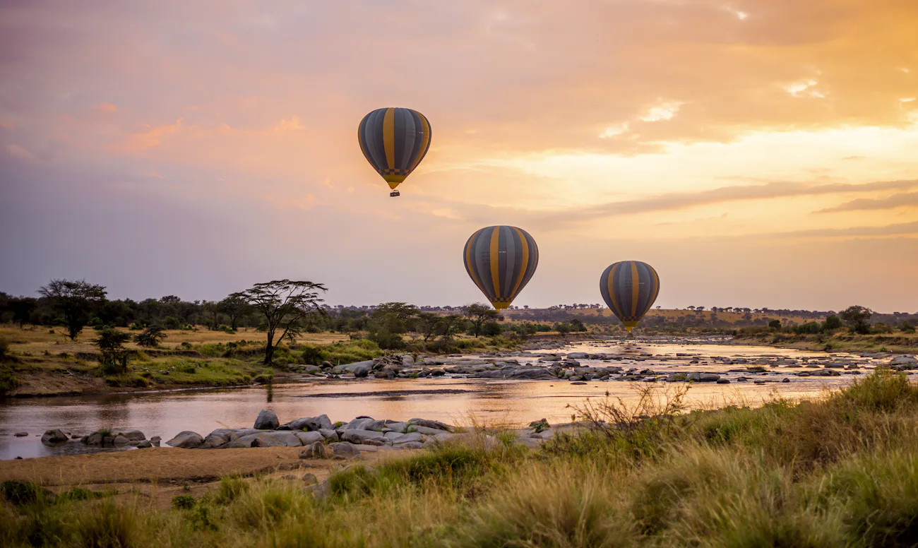 Hot air balloon over the plains at sunrise