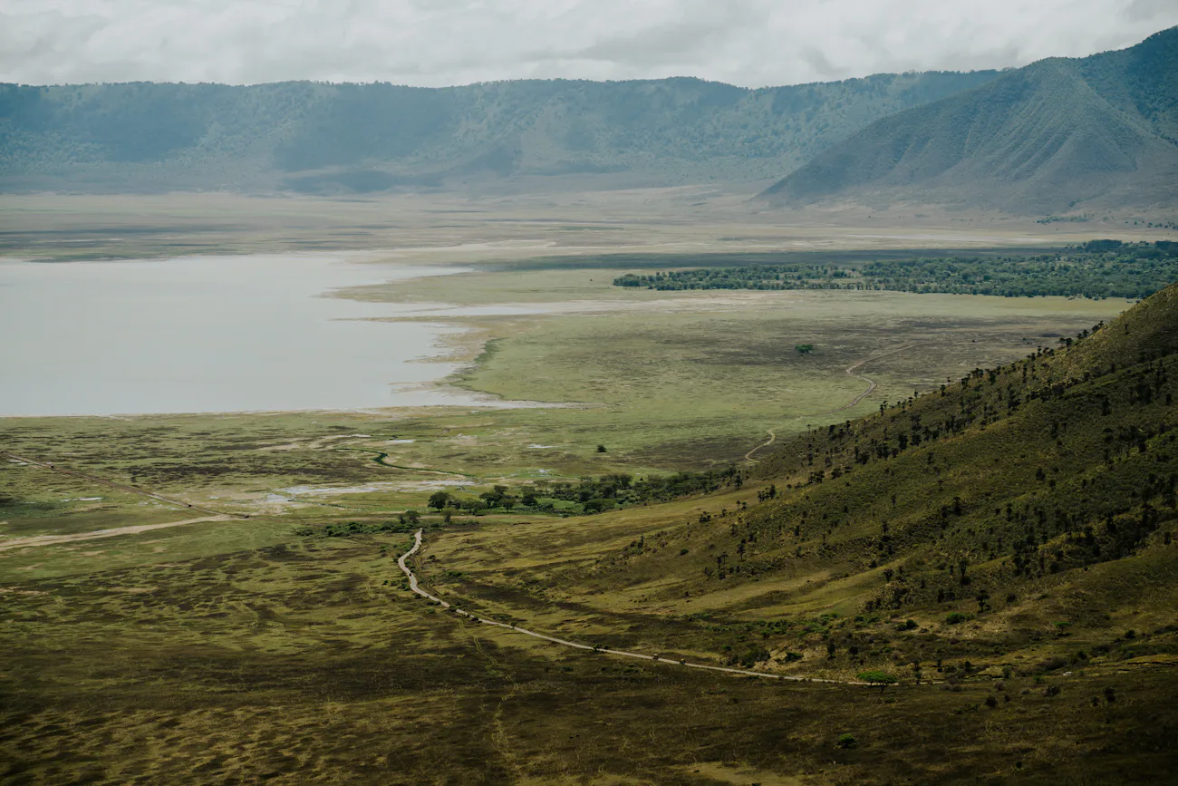The wide caldera floor of Ngorongoro Crater under morning light