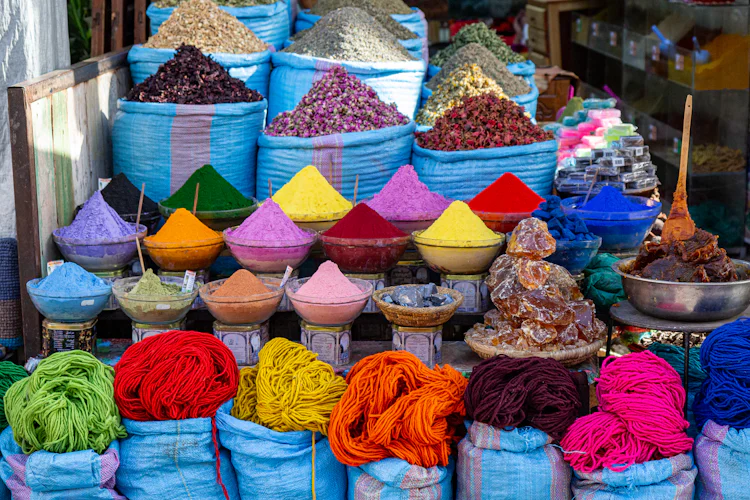 Pyramids of colorful spices at a Zanzibar market stall